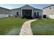 Backyard featuring a screened porch and outdoor seating area at 8164 Forest Edge Dr., Myrtle Beach, SC 29579