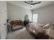 A bedroom offers a crib, a ceiling fan, a bed, and a decorative dresser with a mirror at 8164 Forest Edge Dr., Myrtle Beach, SC 29579