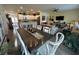 Open-concept dining room flows to kitchen and living area, highlighting modern layout at 8164 Forest Edge Dr., Myrtle Beach, SC 29579