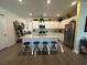 Bright kitchen features island with seating, granite counters, stainless appliances, and ample cabinets at 8164 Forest Edge Dr., Myrtle Beach, SC 29579