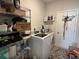 Functional laundry room with washer, dryer, storage shelves, and ample space at 8164 Forest Edge Dr., Myrtle Beach, SC 29579