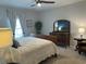 Serene main bedroom with soft lighting, showcasing a comfortable and inviting space at 8164 Forest Edge Dr., Myrtle Beach, SC 29579