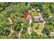 An aerial view showcasing the property's location, landscaping, and surrounding neighborhood with mature trees at 823 Bellamy Ave., Murrells Inlet, SC 29576