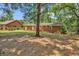 Spacious backyard featuring a well-maintained lawn and mature trees, perfect for outdoor activities at 823 Bellamy Ave., Murrells Inlet, SC 29576