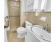 Bathroom featuring tiled walls, a walk-in shower, and vanity with sink at 823 Bellamy Ave., Murrells Inlet, SC 29576