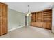 Open dining area featuring wooden built-in shelving and natural light at 823 Bellamy Ave., Murrells Inlet, SC 29576