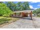 Cozy brick home with covered carport and a well-manicured yard at 823 Bellamy Ave., Murrells Inlet, SC 29576