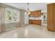Cozy kitchen area with natural light, a breakfast bar, and ample wood cabinet storage space at 823 Bellamy Ave., Murrells Inlet, SC 29576
