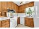 Bright kitchen with wooden cabinets and white appliances at 823 Bellamy Ave., Murrells Inlet, SC 29576