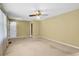 Spacious living room featuring neutral walls, carpet flooring, and a ceiling fan for comfortable living at 823 Bellamy Ave., Murrells Inlet, SC 29576