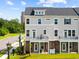 Charming three-story townhome with inviting balconies, perfect for enjoying outdoor living at 8468 Duke Pl. # 28, Myrtle Beach, SC 29572