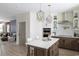 Open kitchen featuring a central island, stainless steel appliances, and elegant pendant lighting at 8468 Duke Pl. # 28, Myrtle Beach, SC 29572