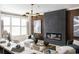 Bright living room features modern fireplace, stylish lighting, and wood accent wall at 8468 Duke Pl. # 28, Myrtle Beach, SC 29572