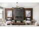 Sophisticated living room with a modern fireplace, sleek lighting, and comfortable seating at 8468 Duke Pl. # 28, Myrtle Beach, SC 29572