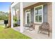 Inviting patio with stylish seating and a view of the landscaped yard, great for relaxing at 8468 Duke Pl. # 28, Myrtle Beach, SC 29572