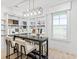 Bright display room with large table, sample display, and natural lighting from large window at 8470 Duke Pl. # 29, Myrtle Beach, SC 29572