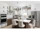 Bright kitchen with white cabinetry, stainless steel appliances, and a marble island with seating at 8470 Duke Pl. # 29, Myrtle Beach, SC 29572