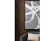 Stylish artwork hangs above seating in a living room with elegant wood-paneled walls at 8470 Duke Pl. # 29, Myrtle Beach, SC 29572