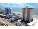 Stunning aerial view of oceanfront condo complex with ocean views at 912 N Waccamaw Dr. # 202, Garden City Beach, SC 29576