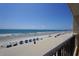 Expansive beach view, seen from a condo with umbrellas at 912 N Waccamaw Dr. # 202, Garden City Beach, SC 29576