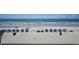Beautiful beach scene with blue umbrellas, viewed from a condo at 912 N Waccamaw Dr. # 202, Garden City Beach, SC 29576