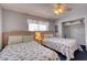 Comfortable bedroom features twin beds with seashell patterned bedding, a ceiling fan, and a closet at 912 N Waccamaw Dr. # 202, Garden City Beach, SC 29576