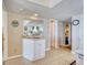 View of the hallway that includes a sink with small cabinet, closet, and entry into the bedroom at 912 N Waccamaw Dr. # 202, Garden City Beach, SC 29576