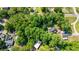 Aerial view of a property with outbuildings and dense trees in a charming neighborhood setting at 938 Fox Hollow Rd., Conway, SC 29526