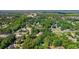 High aerial view of a neighborhood with houses nestled among dense trees and lush greenery at 938 Fox Hollow Rd., Conway, SC 29526