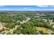 Expansive aerial view of a neighborhood with houses interspersed among lush trees and natural landscapes at 938 Fox Hollow Rd., Conway, SC 29526