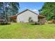 View of back of house, shed with a lean-to, and lawn at 938 Fox Hollow Rd., Conway, SC 29526