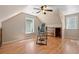 Finished bonus room featuring hardwood flooring, built-ins, and natural light at 938 Fox Hollow Rd., Conway, SC 29526