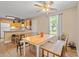 Bright dining area features a ceiling fan, natural lighting, with access to the kitchen at 938 Fox Hollow Rd., Conway, SC 29526