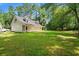 Exterior of house with a large green lawn and mature trees at 938 Fox Hollow Rd., Conway, SC 29526
