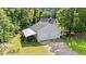 Aerial view of the garage with two doors, shed, and a view of the home amidst lush green trees at 938 Fox Hollow Rd., Conway, SC 29526
