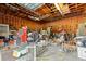 Garage interior with lots of tools, equipment, and exposed rafters at 938 Fox Hollow Rd., Conway, SC 29526