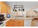 Open kitchen with stainless steel appliances, a breakfast bar, and view to dining area at 938 Fox Hollow Rd., Conway, SC 29526