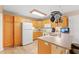 Functional kitchen with wooden cabinets, neutral countertops and modern appliances at 938 Fox Hollow Rd., Conway, SC 29526