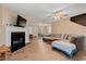 Spacious living room with a fireplace, ceiling fan and an open floorplan to dining room at 938 Fox Hollow Rd., Conway, SC 29526