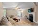 Inviting living room with neutral walls, a fireplace, ceiling fan, and wood-look flooring at 938 Fox Hollow Rd., Conway, SC 29526