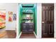 Chic bar area featuring a mini cabinet, open shelving, and vibrant wallpaper adding a modern touch at 9755 Leyland Dr. # 2, Myrtle Beach, SC 29572