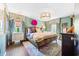 Stylish bedroom with colorful accents, unique lighting, and large windows that enhance the space at 9755 Leyland Dr. # 2, Myrtle Beach, SC 29572