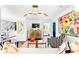 Cozy living area with colorful artwork, stylish furniture, and views of the kitchen at 9755 Leyland Dr. # 2, Myrtle Beach, SC 29572