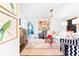 Bright living room with eclectic decor, including colorful artwork and patterned accent chairs at 9755 Leyland Dr. # 2, Myrtle Beach, SC 29572