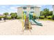 A community playground featuring a slide and climbing structure, perfect for Gathering fun at 9755 Leyland Dr. # 2, Myrtle Beach, SC 29572