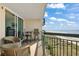 Balcony showing the beach and the ocean with outdoor furniture at 1003 S Ocean Blvd. # 802, North Myrtle Beach, SC 29582