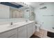 Bathroom featuring a double sink vanity, light fixtures and marine-themed decorations at 1003 S Ocean Blvd. # 802, North Myrtle Beach, SC 29582