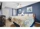 Comfortable bedroom featuring two cozy beds, ample lighting and soothing blue walls at 1003 S Ocean Blvd. # 802, North Myrtle Beach, SC 29582