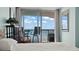 Bedroom showcasing sliding glass doors leading to a private balcony with ocean views at 1003 S Ocean Blvd. # 802, North Myrtle Beach, SC 29582