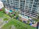Aerial view showcasing the building's landscaping and beachfront pool at 1003 S Ocean Blvd. # 802, North Myrtle Beach, SC 29582